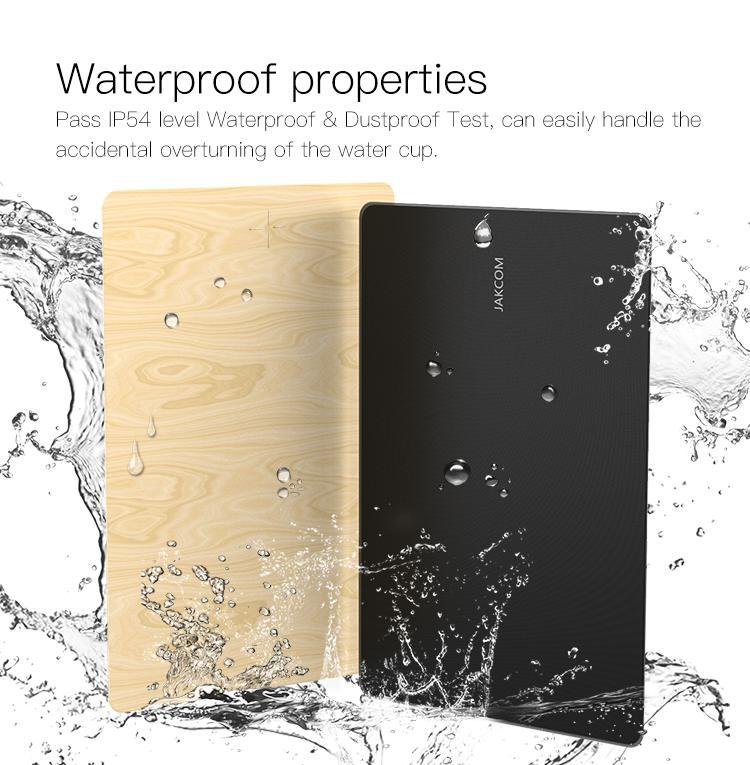 Two power banks, one wooden and one black, with water droplets around them on a white background.