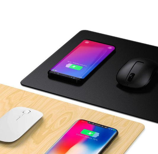 Two smartphones and two mice on black and wooden mouse pads.