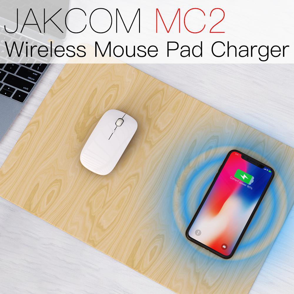 JAKCOM MC2 Wireless Mouse Pad Charger with a mouse and smartphone on a wooden surface.