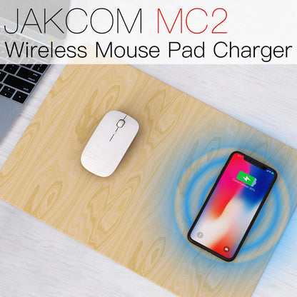 JAKCOM MC2 Wireless Mouse Pad Charger with a mouse and smartphone on a wooden surface.