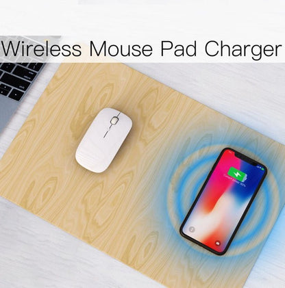 Wireless mouse pad charger with a mouse and phone on a wooden surface