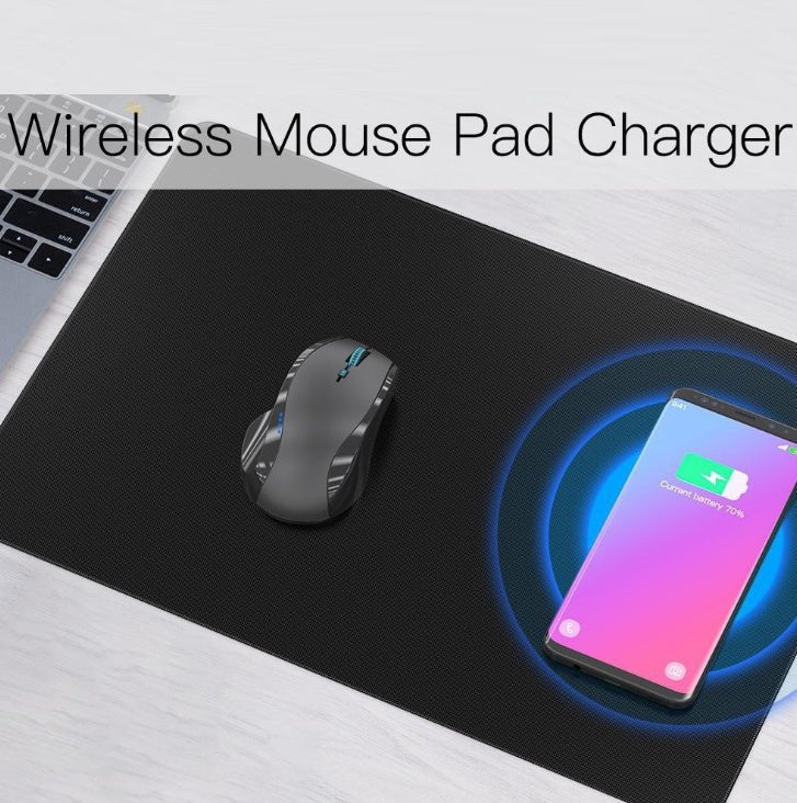 Wireless mouse pad charger with a mouse and smartphone on a desk
