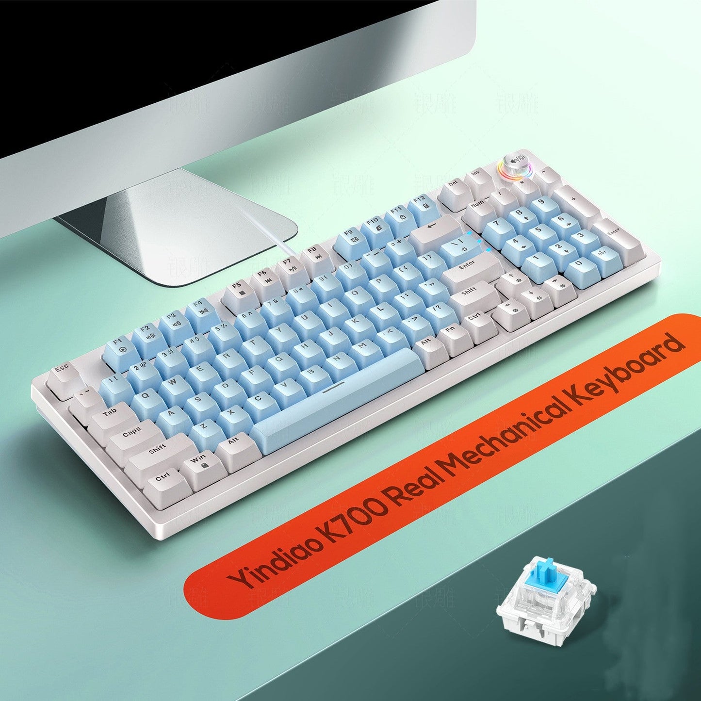Mechanical keyboard with gradient blue and white keys on a green desk, featuring the brand 'Yiniao'.
