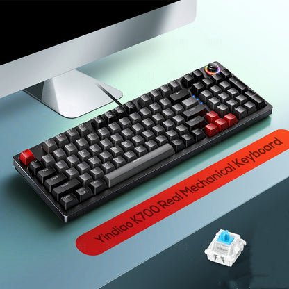 Mechanical keyboard with red escape key on a desk, featuring a Yindao K700 Real Mechanical Keyboard label.