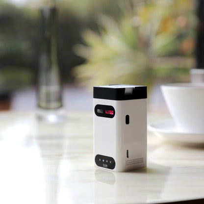 Small electronic device on a table with a blurred background