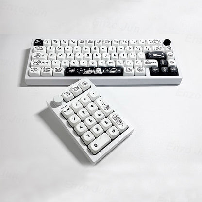 White keyboard with cartoon character keys on a light gray background