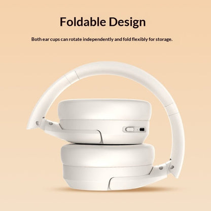 Foldable white headphones on a beige background with text about their design.