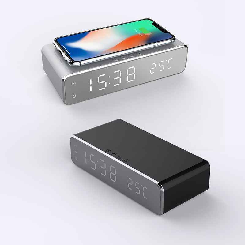 Digital clock with smartphone stand on a white background