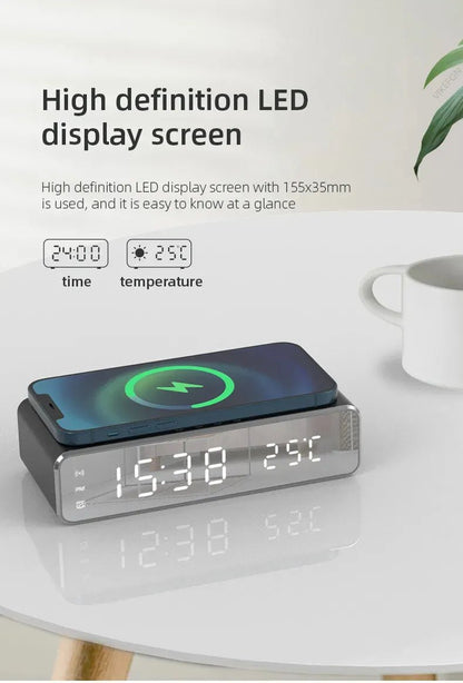 Digital clock with LED display on a white surface, showing time and temperature.