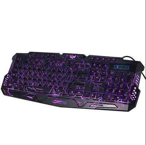 Gaming keyboard with purple backlighting on a white background