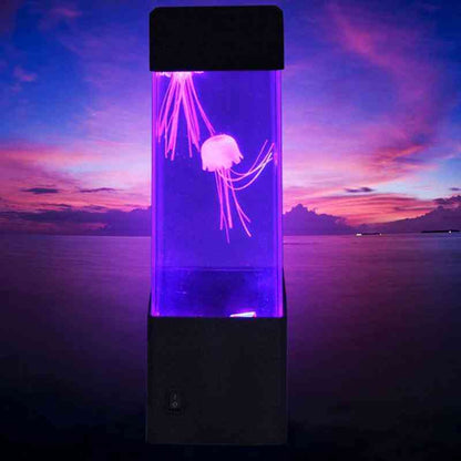 Jellyfish tank with a purple glow against a sunset sky