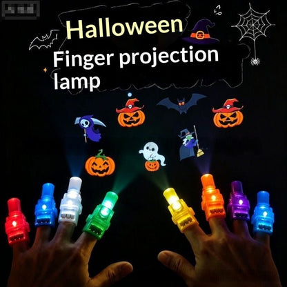 Halloween finger projection lamp shown being worn on both hands, with colorful illuminated finger lights casting projected graphics of pumpkins, ghosts, bats, and a witch on a black background. Text at the top reads 'Halloween Finger projection lamp'.