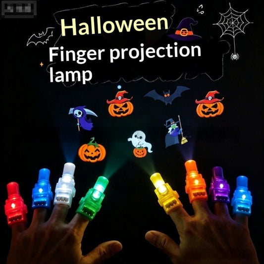 Halloween finger projection lamp shown being worn on both hands, with colorful illuminated finger lights casting projected graphics of pumpkins, ghosts, bats, and a witch on a black background. Text at the top reads 'Halloween Finger projection lamp'.