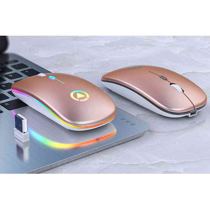 Two rose gold wireless computer mice on a laptop with a USB receiver emitting colorful lights.