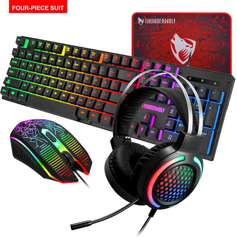 Gaming setup with keyboard, mouse, headset, and mouse pad featuring Thunderwolf branding.