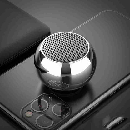Metallic ball-shaped car mount on a smartphone