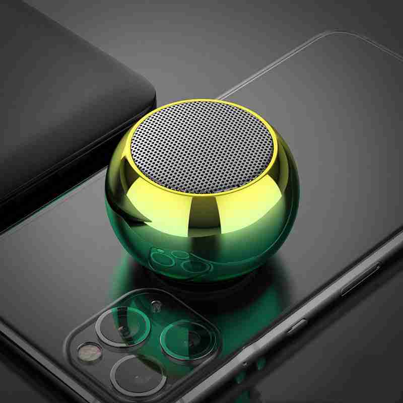 Green metallic ball-shaped object on a smartphone