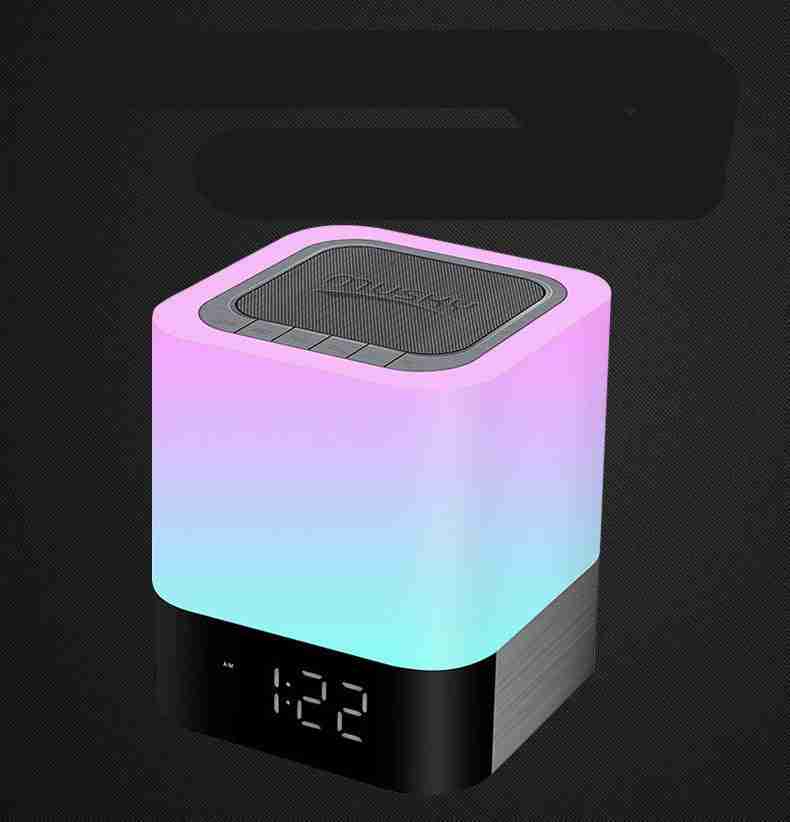Colorful LED night light with digital clock on a black background