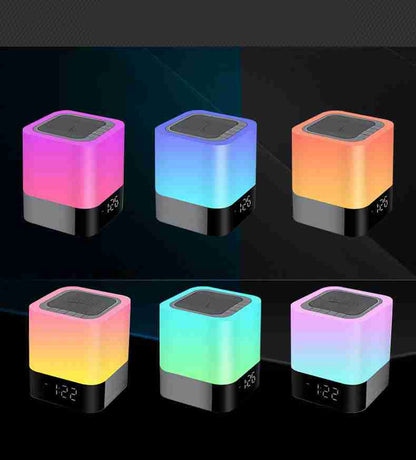 Colorful cube-shaped night lights with digital display on a dark background