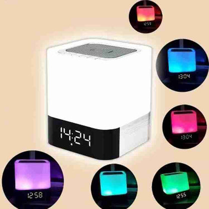 Multicolored digital clock with LED display on a beige background