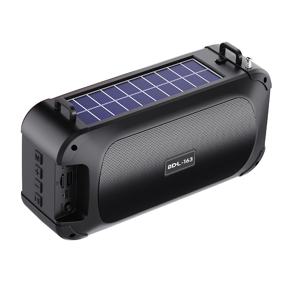 Black portable speaker with solar panel on a white background