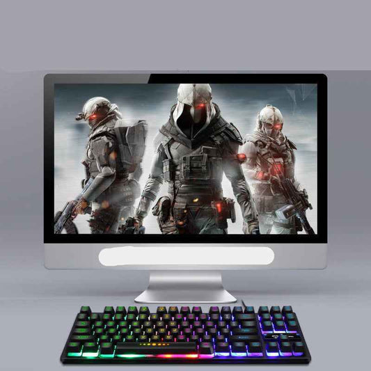 Computer monitor displaying a futuristic soldier wallpaper with a keyboard in front.