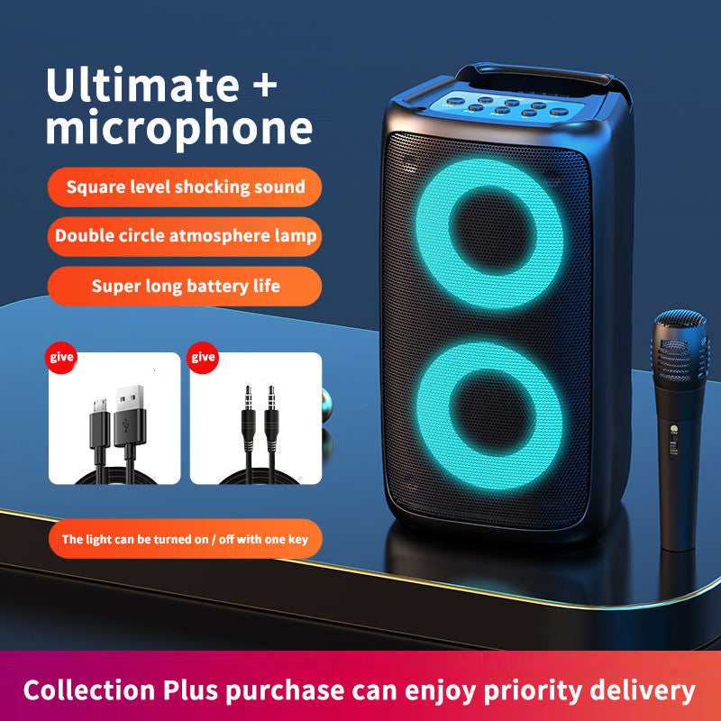 Portable speaker with microphone and charging cables on a dark blue background