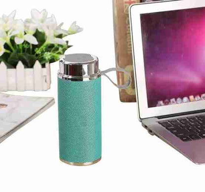 Turquoise textured water bottle with silver cap next to a laptop on a desk.