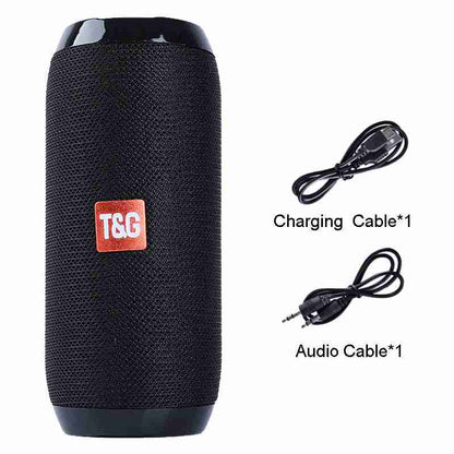 Black portable speaker with T&G logo, charging cable, and audio cable on a white background