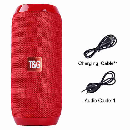 Red portable speaker with T&G logo, charging cable, and audio cable on a white background