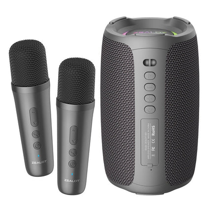 Two wireless microphones and a portable speaker with Zealot branding on a white background