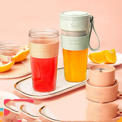 Onnkaie travel mugs with drinks on a pink background