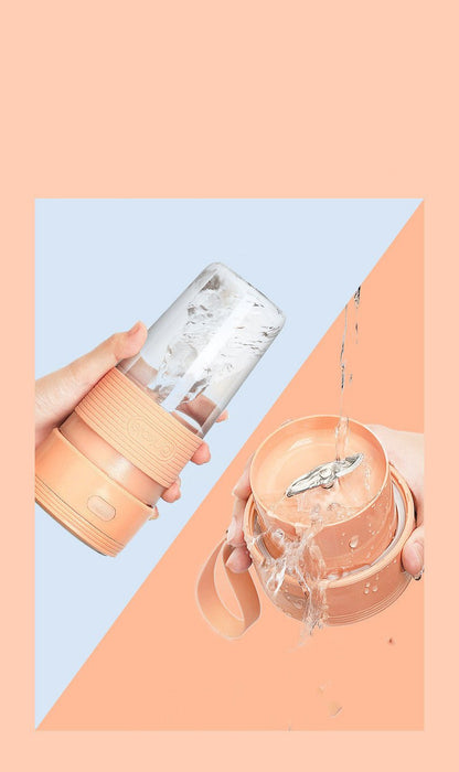 Two hands holding a clear glass with a metal straw and an orange container on a colorful background