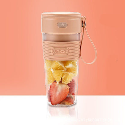 Portable fruit juice maker with fruits inside on a peach background