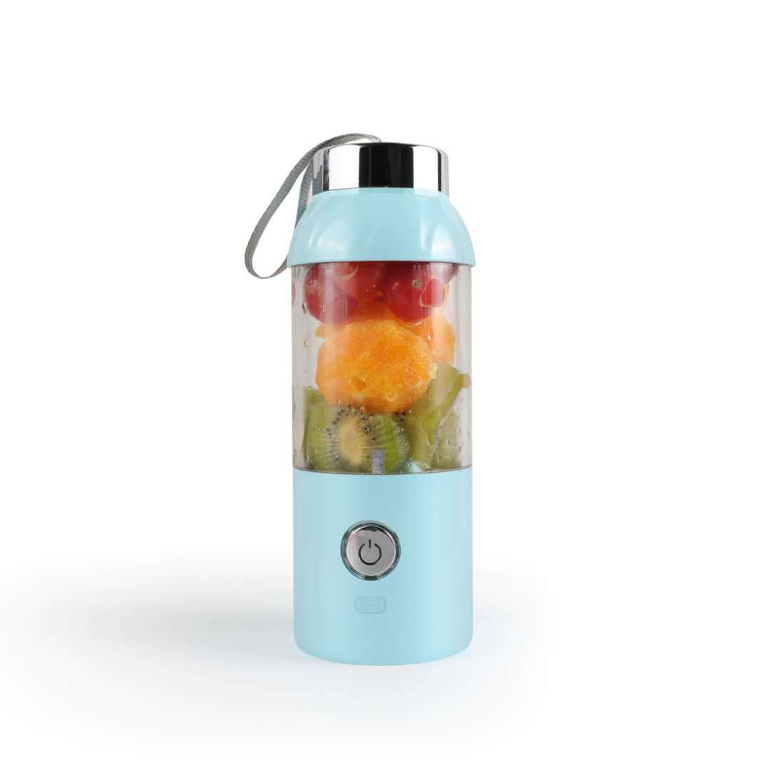 Portable blender with fruits inside on a white background