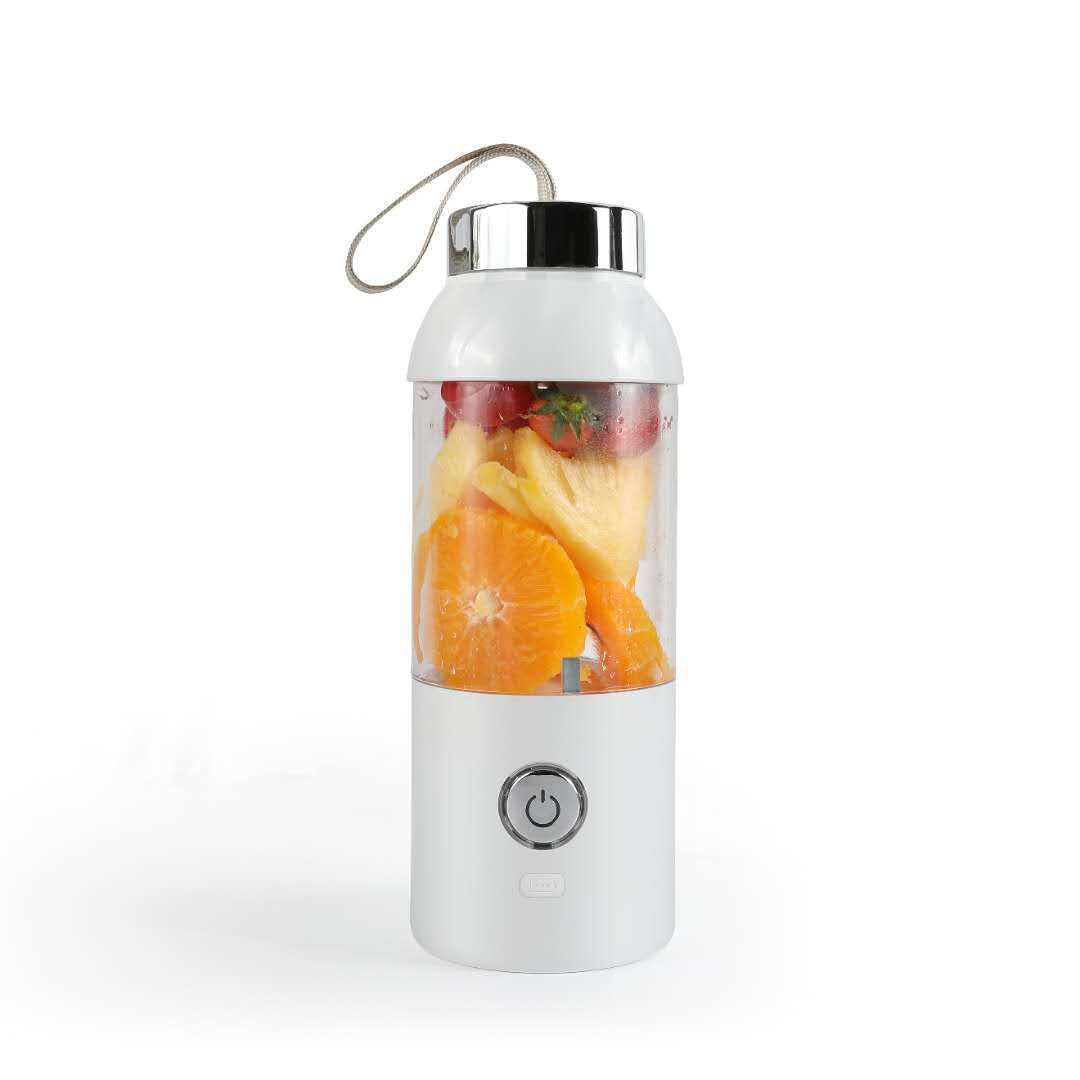 Portable blender with fruits inside on a white background