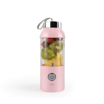 Pink portable blender with fruits inside on a white background