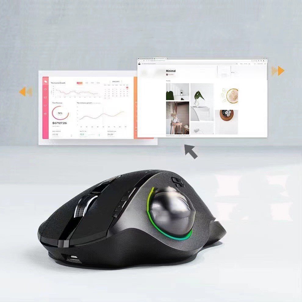 Black computer mouse with a trackball on a light gray background