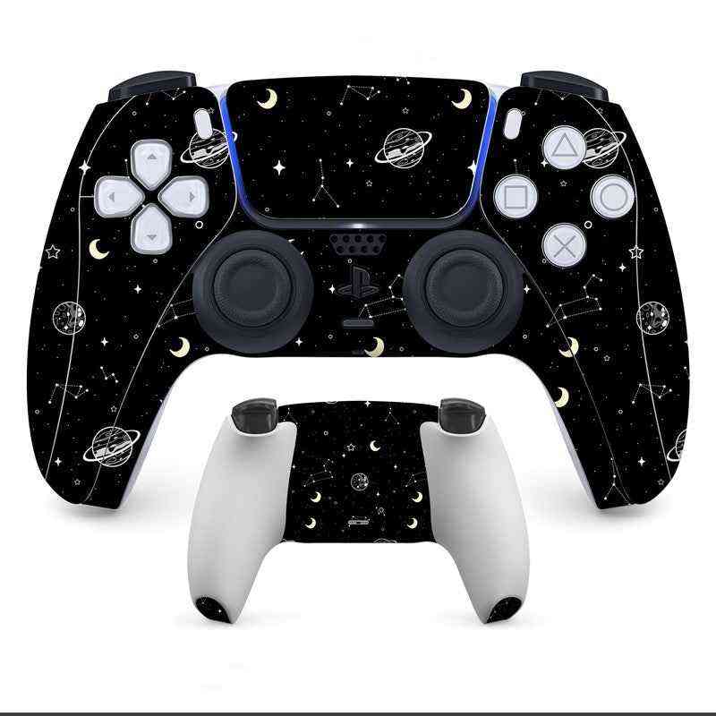Black gaming controller with space-themed design on a white background