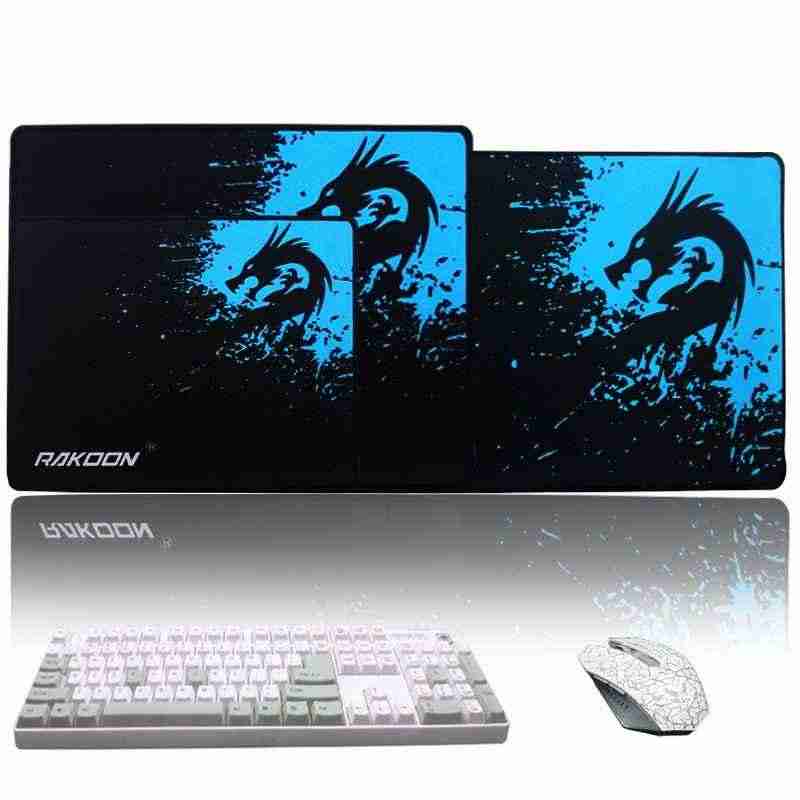 Gaming mouse pad with dragon design, keyboard, and mouse on a white background