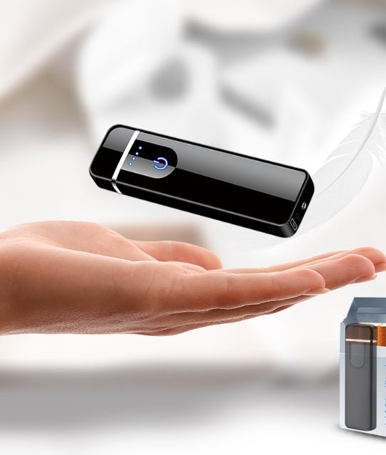 Black electronic device hovering above a hand with a blurred background