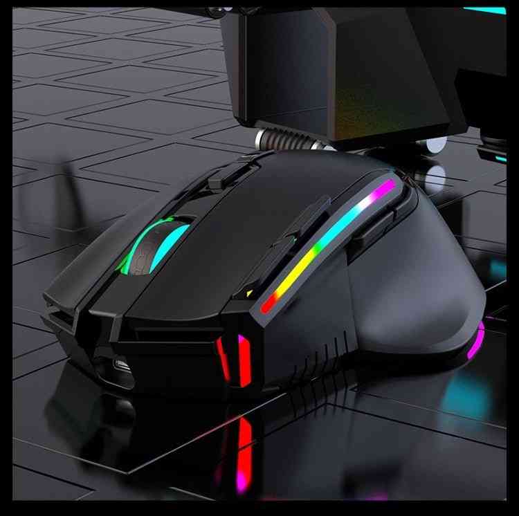 Gaming mouse with RGB lighting on a reflective surface