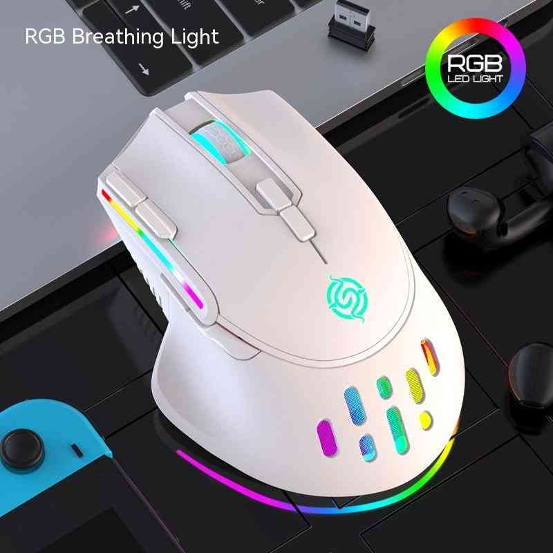 White gaming mouse with RGB lighting on a desk