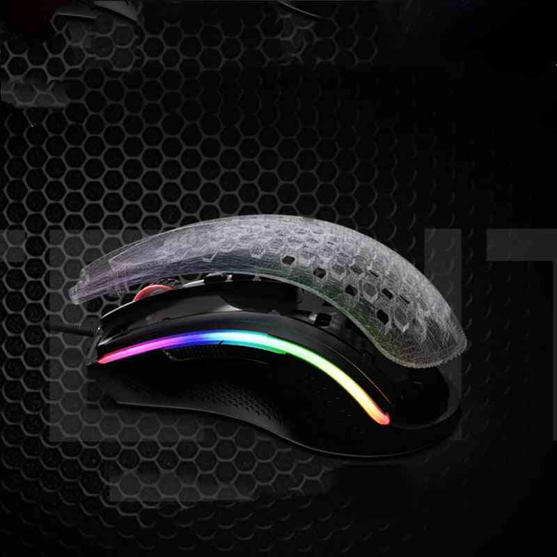 Gaming mouse with RGB lighting on a dark honeycomb background
