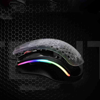 Gaming mouse with RGB lighting on a dark honeycomb background