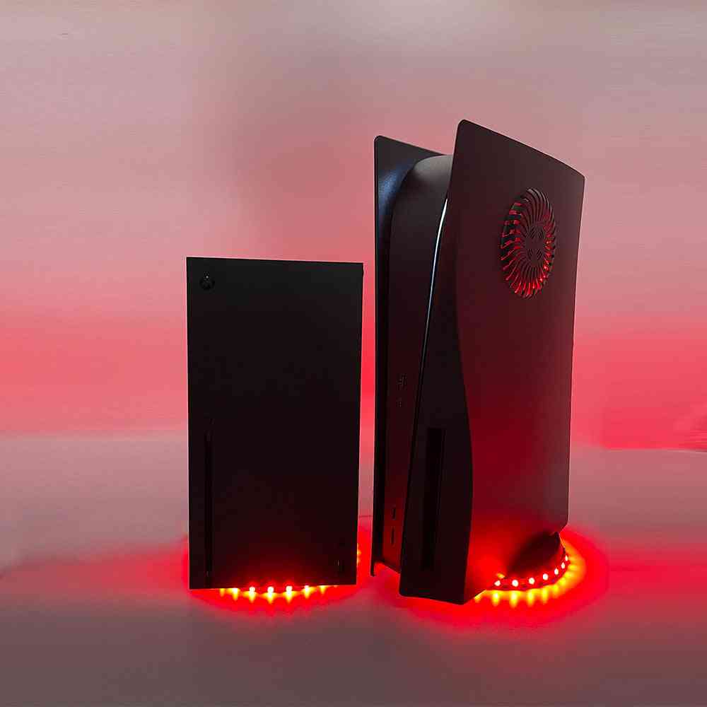 Gaming console with red LED lights on a gradient background
