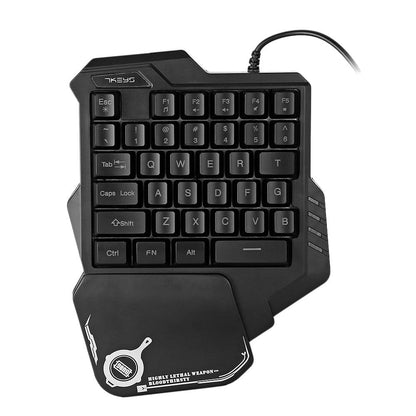Black one-handed gaming keyboard with wrist rest on a white background