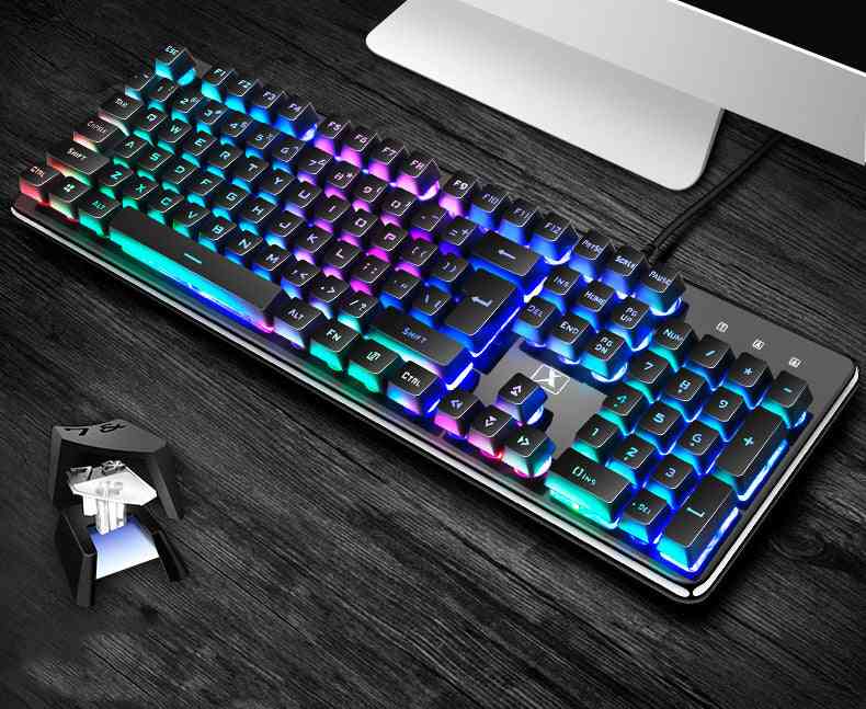 Rear view of a mechanical keyboard with RGB lighting on a dark wooden desk.