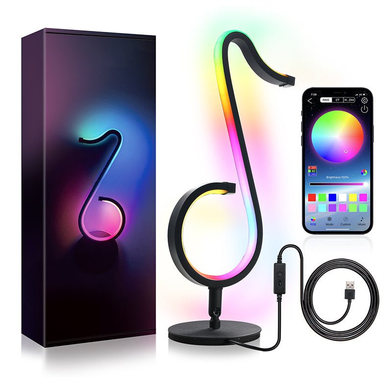 RGB Symphony Atmosphere Table Lamp shaped like a music note with smartphone app control, packaging, and USB cable.