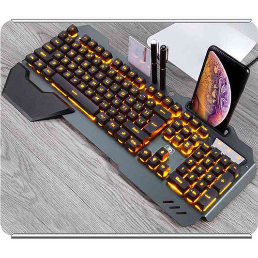 RGB Wired Gaming Keyboard with RGB lighting on a desk with a phone and pen holder.